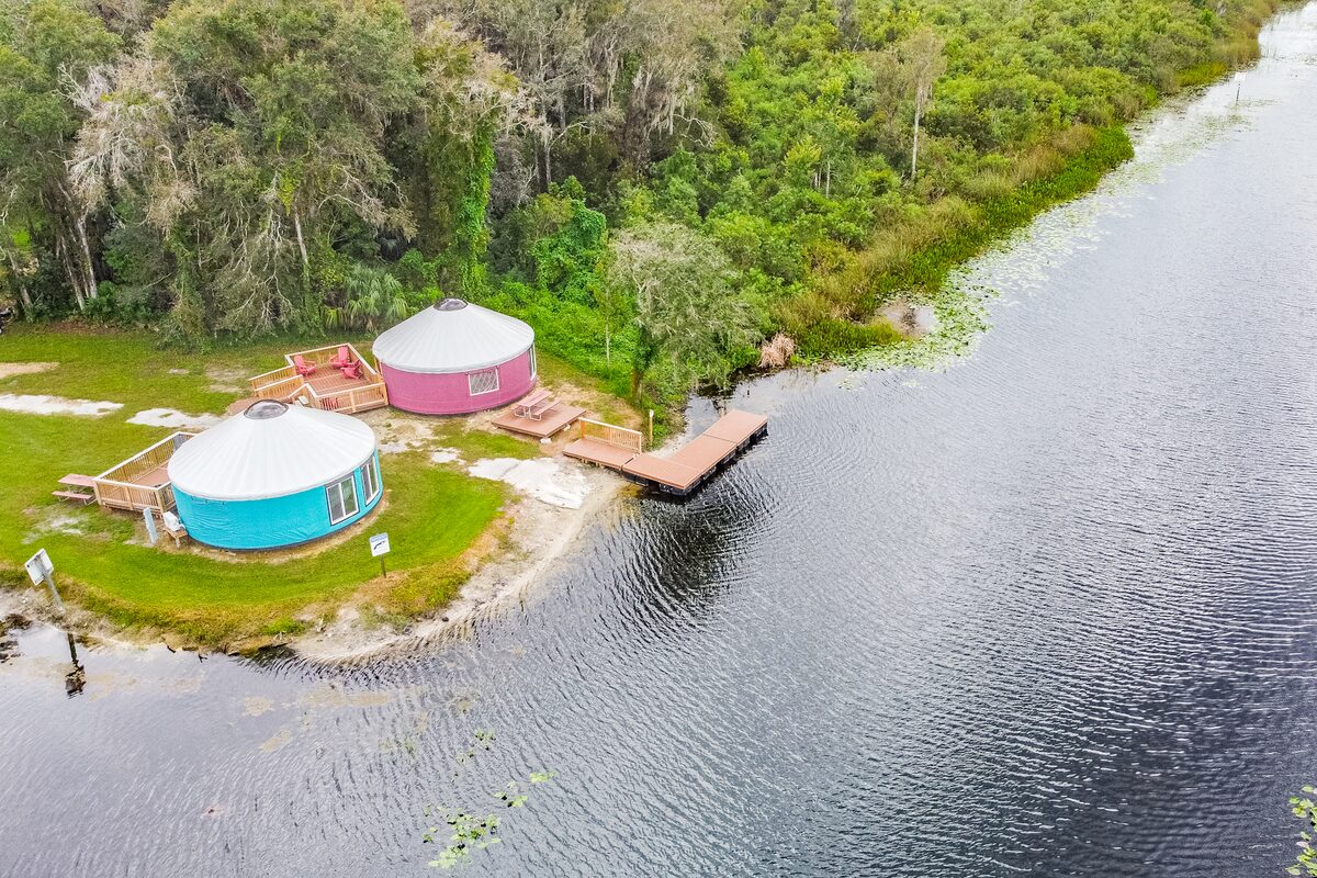 Aerial view of the yurts, dock and river